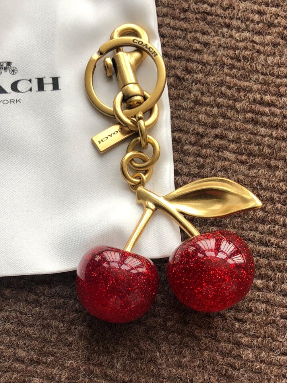 Coach Gold-Tone Cherry Key Charm with Red Glitter